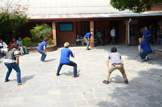 OHI team playing a game of cricket with the patients in Nepal