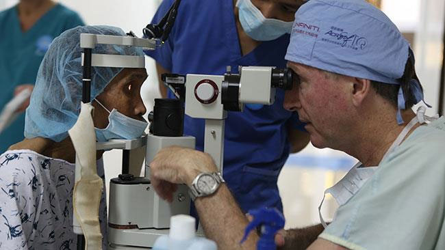 Dr assessing the eye of a patient in the Philippines