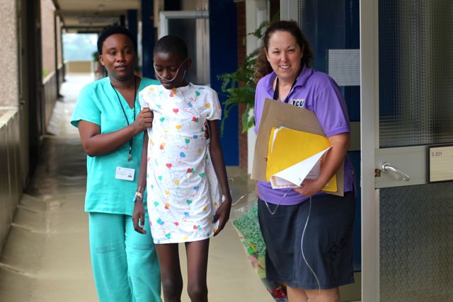 Rwandan cardiac patient walking from ICU