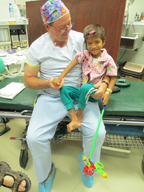 Cambodian heart patient with surgeon