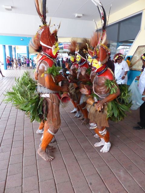 huli dancers at port moresby airport