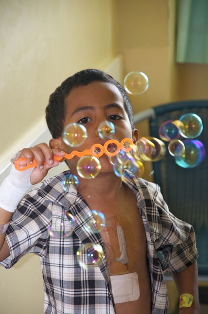 Tongan cardiac patient blowing bubbles 