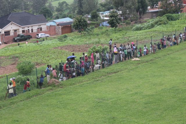 Locals watching helicopter land